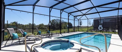 Oversized heated pool, complete with hot tub with four chaise lounge chairs. Pool comes with colored LED lights to ensure any night swims magical. 