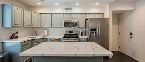 Kitchen with open to above loft area