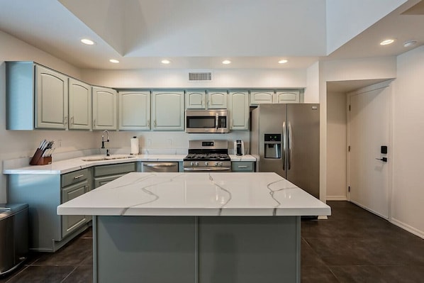 Kitchen with open to above loft area