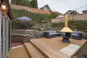 The patio is very private and features multiple seating areas and a fire pit for you to use during your stay. The string lights in the evening make this the perfect space to unwind with friends