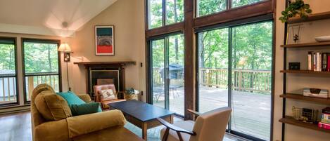 Living room with views of the forest.