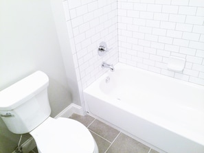 Awesome updated bathroom complete with subway tile shower