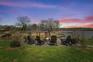 Experience the magic of a crackling fire under the stars while sinking into our inviting Adirondack chairs, perfect for creating cherished moments with family and friends.
