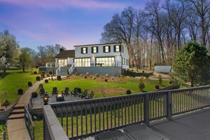 Escape to your own private oasis in our expansive backyard, complete with a cozy fire pit and towering trees. Enjoy a night under the stars with loved ones or a peaceful afternoon of relaxation in nature.