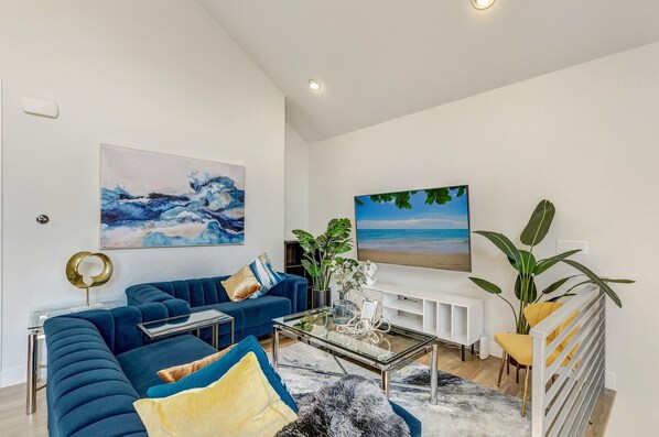 Spacious Living Room with large 70" Samsung Smart TV and seating for 6