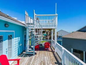 Stunning views from your private deck with vibrant seating and spiral stairs!