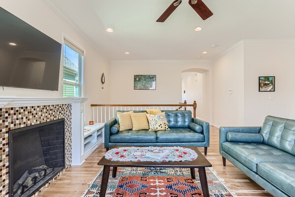 Beautiful living room with smart tv and electric fireplace.