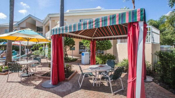 Take a load off under the outdoor cabana near the pool. 