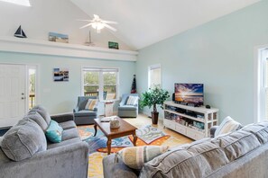 With Large Windows, the Living Area is Flooded with Natural Light. Plenty of Comfortable Seating for Everyone to Gather Together.