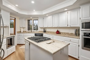 The kitchen is spacious and efficient. Perfect place to prepare a family meal.