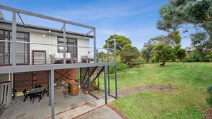 Shaded patio area and sunny deck above 