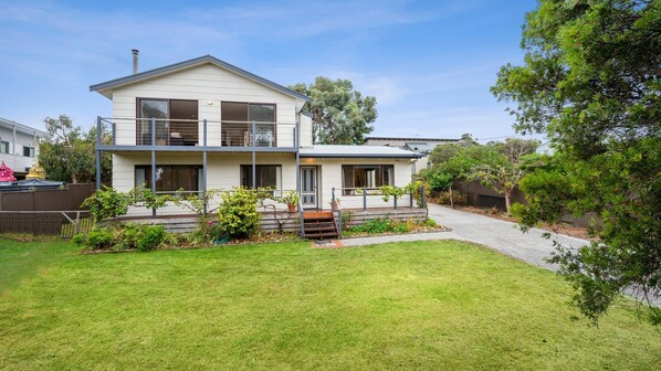 Front view of Three Beaches with garden and bedroom balcony