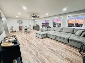 Living room area with sleeper sectional 
