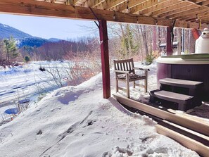 Warm up and unwind in the hot tub, tucked beneath the deck — the perfect winter retreat!