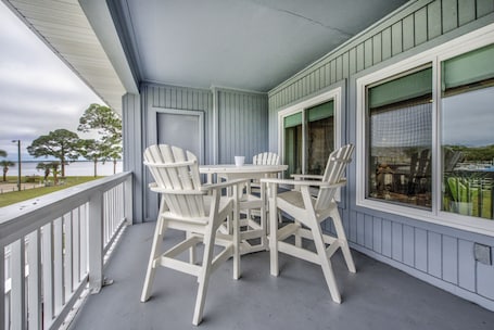 Marina side balcony, showing table and 4 chairs, with additional bay view.