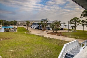 Marina side balcony, with additional view of bay.  Contains table and 4 chairs.