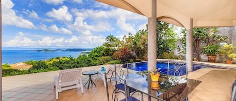 Casa OM offers a massive, shaded terrace with stunning ocean views of the Playa Hermosa and the Papagayo Peninsula.  