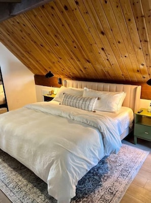 Upstairs master suite with premium mattress and bedding and streaming tv.