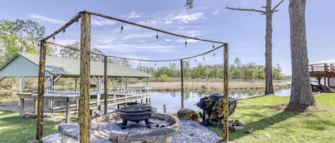 Large fire pit, excellent family cook out and recreation area, water view.