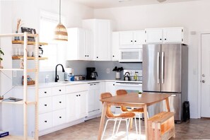 Fully equipped kitchen (coffee pot, french press, toaster, blender, pots/pans, dinnerware, utensils, cooking sheets, & more)