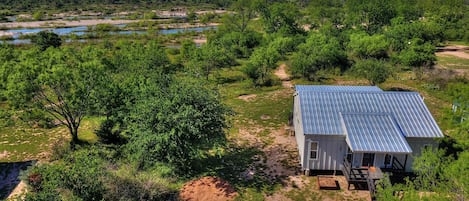 The Llano river flows along the back of the property.