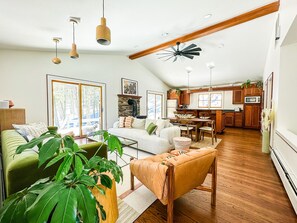 Open kitchen and living room, tucked away in privacy, surrounded by trees
