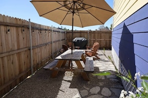 Private backyard with Grill, Firepit, Picnic Table, and Hammock.