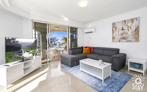 The elegant living area is right next to the balcony 