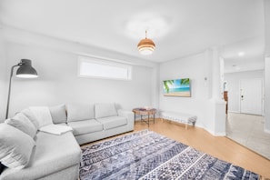 Spacious living room just off the kitchen. Perfect for entertaining while preparing the perfect meal!