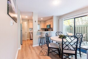 Dining table leading to kitchen