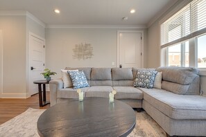 2nd Unit: Modern Living Space featuring designer furnishings and a flat-screen SMART TV overlooking the fully equipped kitchen.