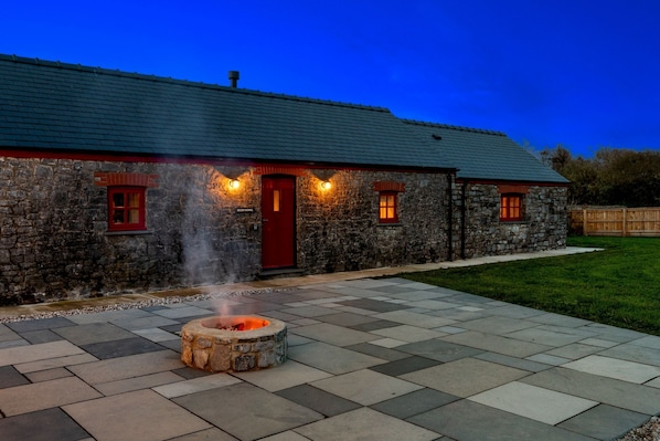 Toast marshmallows around the fire pit