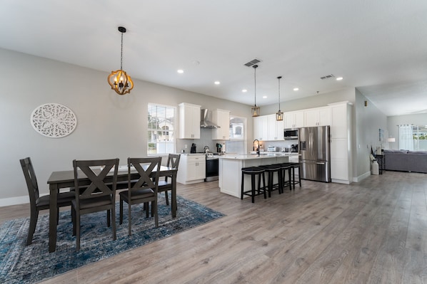 Spacious Living Area with Dining Table and Full Size Kitchen