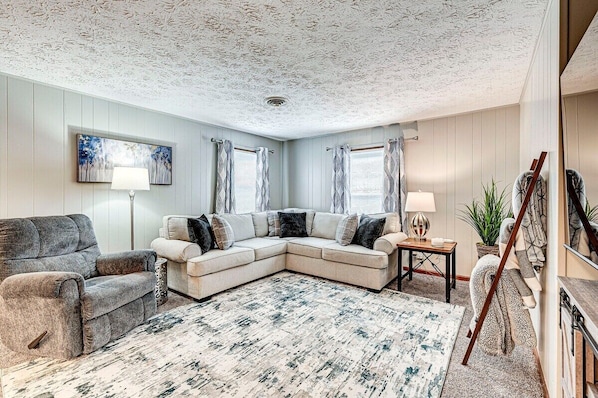 Living room with large smart tv and fireplace