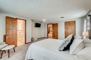 Primary bedroom with queen-sized bed and en suite bath