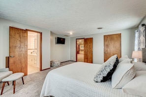 Primary bedroom with queen-sized bed and en suite bath