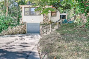 front view of River Heights Bungalow w approx 16 steps up to the front door.