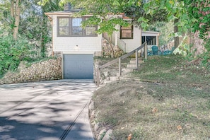 front view of River Heights Bungalow w approx 16 steps up to the front door.