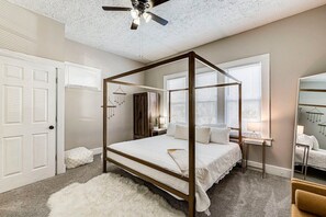primary bedroom w/ king sized bed