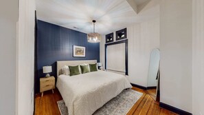 Beside the bed, you'll find a convenient side table, perfect for keeping your valuable items close at hand. There's also a body-size mirror, so you can check your outfits and look your best before stepping out.