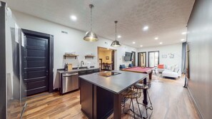 The open layout of the apartment allows easy access to all parts of the kitchen as you enter. With no partitions hindering your movement, you can freely move around and interact with family or guests while preparing meals.