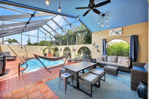 Heated Saltwater Pool/Lanai, lounge chairs, hammock, grill, TV/Sound bar, wine fridge, sink, dining. (1)