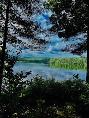 Breathtaking lake-view set against the backdrop of trees and changing colors
