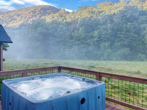 Morning mist with a bubbling hot tub