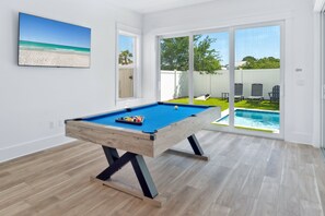 Billiards room overlooking the pool