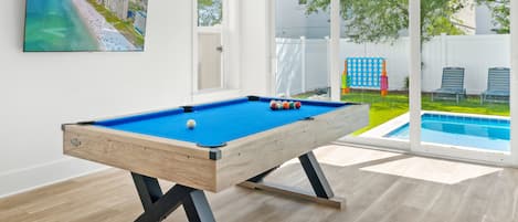 Billiards room with direct access to the pool and outdoor dining area