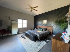 Main Bedroom. King Size Bed. 49”  Mounted TV