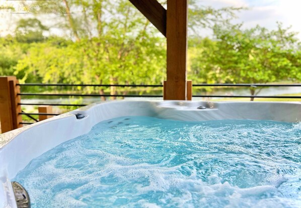 Private hot tub for relaxing evening overlooking the lake!
