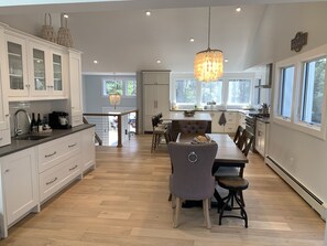 Open concept...fabulous gourmet kitchen with island and dining table