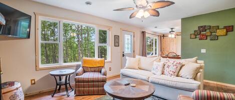 Living Room w/ fireplace, smart TV, wooded views out the enormous windows!